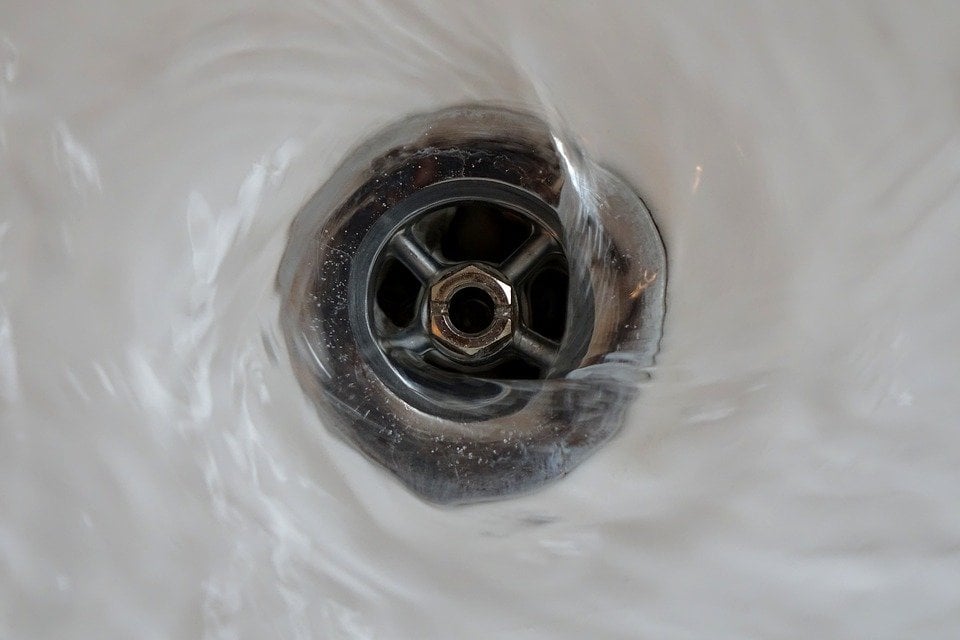 water draining into a sink
