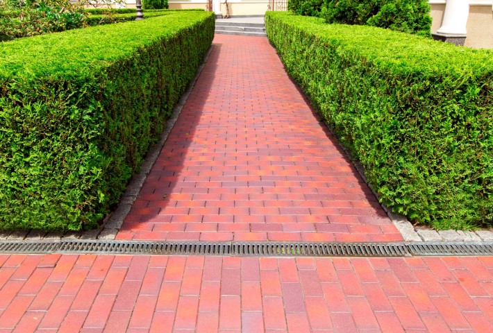 Metal gratings on walkway